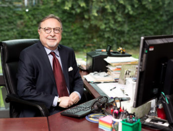 Michael Genovese, seated at his desk in his office