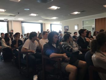 Students sitting at Douglas Smith talk