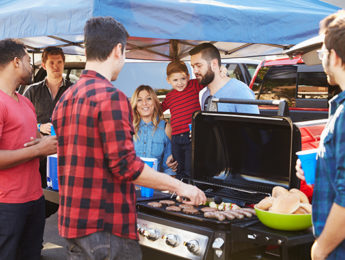 A group tailgating before a sporting event
