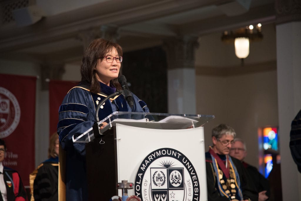 Dean Tina Choe speaking at Academic Awards Convocation in 2018