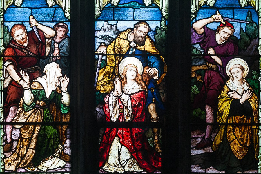 St. Patrick's Cathedral, Armagh, County Armagh, Northern Ireland. Lower lights of the second south-most stained glass window in the west aisle (liturgically south) by Meyer & Co. of Munich, depicting the martyrdom of St. Dympna