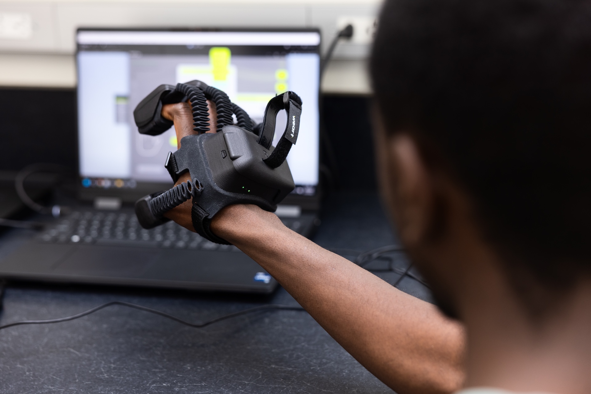 The assistive glove Pierre-Louis worked on this summer