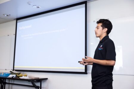 Male student presenting research