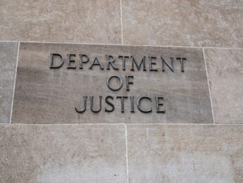 Department of Justice sign on building
