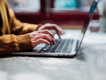 Closeup Shot Of An Unrecognizable Woman Using Laptop