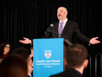 Justin Levitt at podium during LLS Fall Swearing In Ceremony