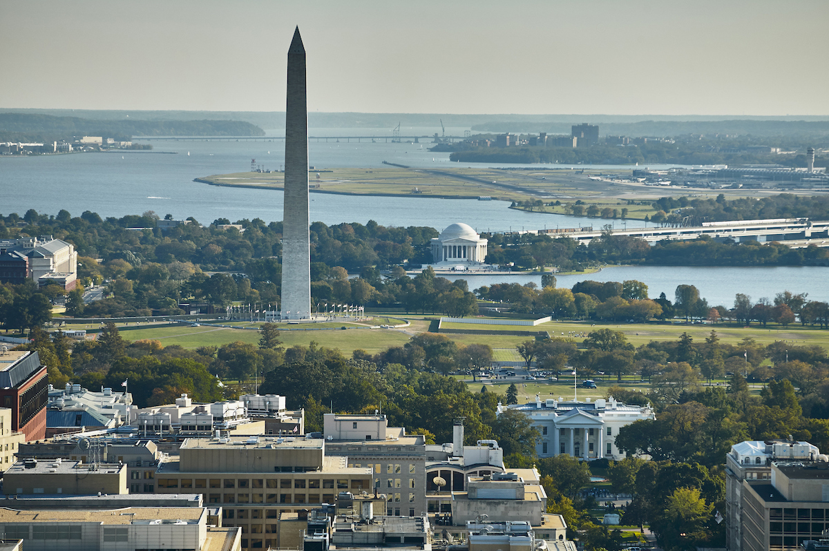 Skyline of Washington D.C. from aerial viewpoint with the Washington Monument in the foreground.