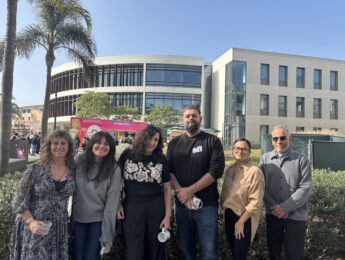 Evelyn McDonnell with (Every Day Is) Taco Tuesday panelists (from left to right): McDonnell, Brittny Mejia (Los Angeles Times), Mandalit del Barco (NPR), Memo Torres (L.A. TACO), Yanira Lemus (Loyola Immigration Law Clinic), and Rubén Martínez (LMU) outside with Taco Trucks in the background.