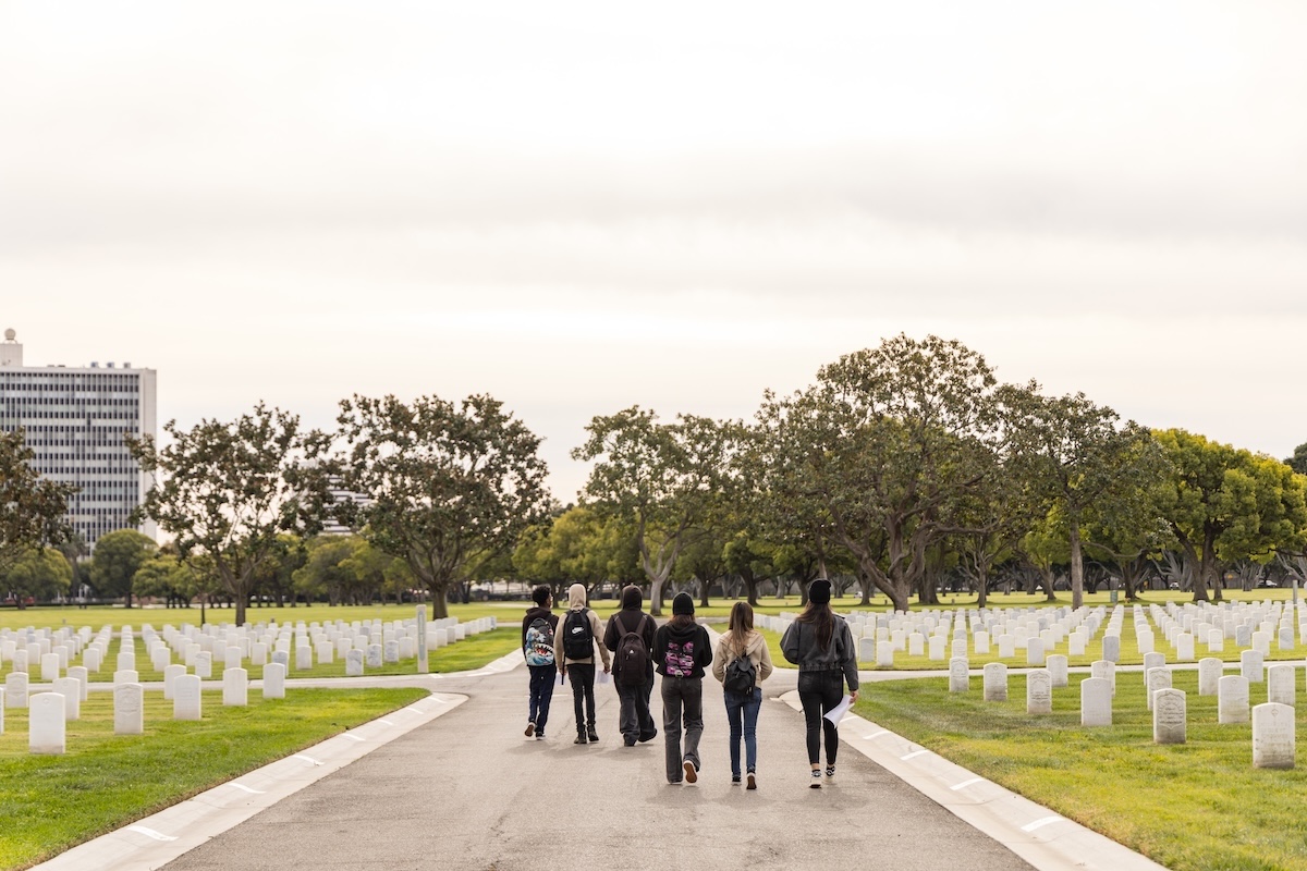 High school students volunteering with LMU’s Digital Veterans Legacy Project recently visited Los Angeles National Cemetery.