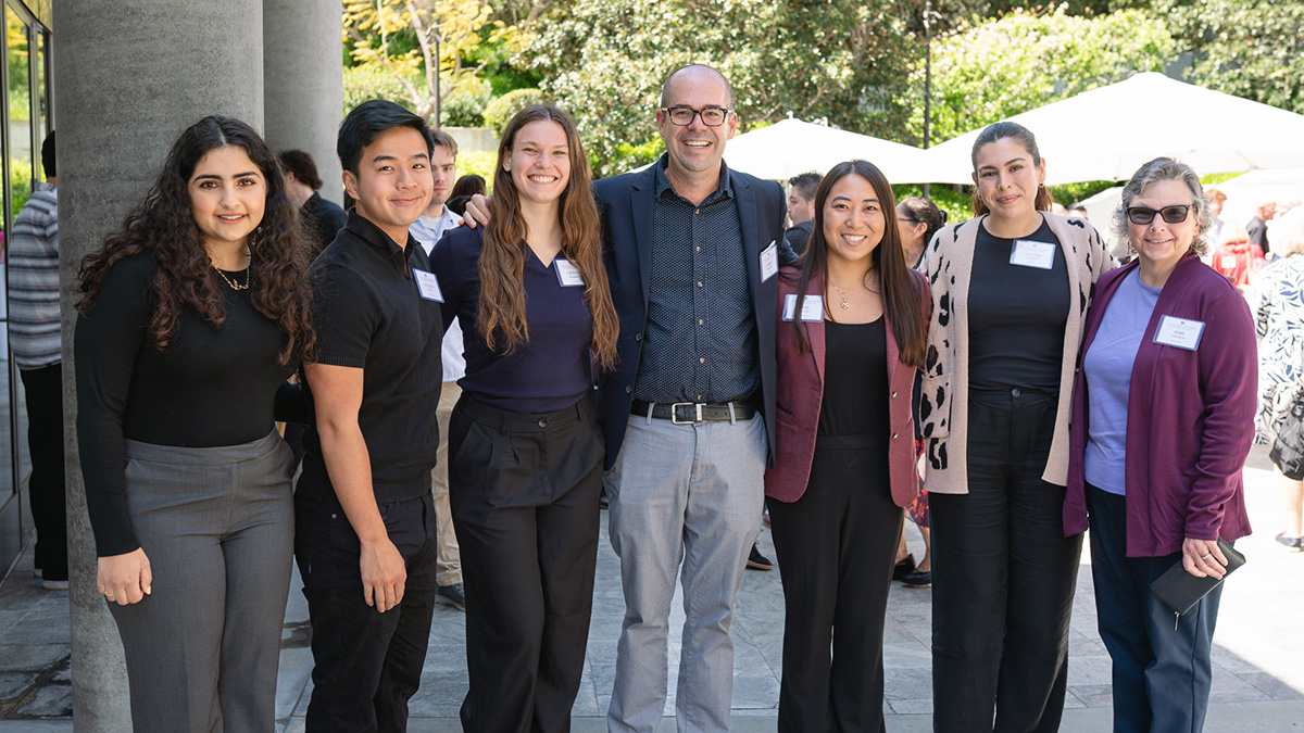 A group of students and staff gather outside during a luncheon honoring LMU's work with Mar Vista Family Center.