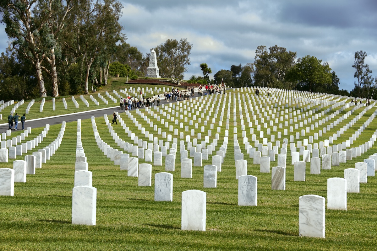 US military veterans' headstones stand in rows at the Los Angeles National Cemetery in Westwood, California. Shot on a cloudy spring morning.
