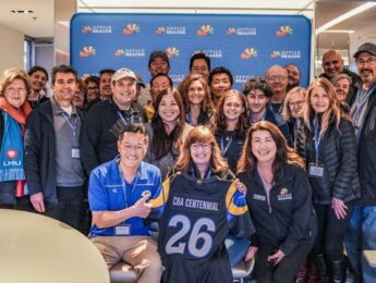 LMU President Thomas Poon and LMU CBA Dean Dayle Smith celebrate CBA’s 100th anniversary with LMU and Office Beacon teams at SoFi Stadium.
