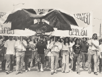 Black and white photo of people marching in Los Angeles during the Chicano Movement that began in the 1960s