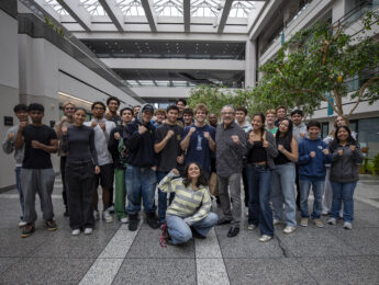 Jacob Stitch Duran with students making boxing poses.