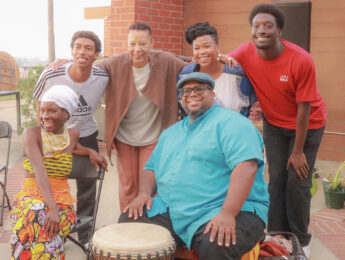 A small group of Black staff, faculty, and students gather outside the Mbongi Spot on campus.