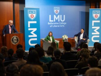 Pelosi being introduced by Dean Fox and on stage with Fernando Guerra