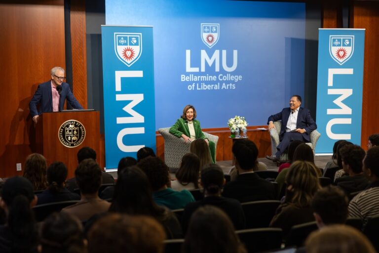 Pelosi being introduced by Dean Fox and on stage with Fernando Guerra