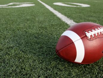 Close-Up Of American Football On Field
