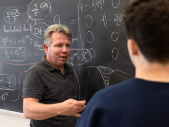 LMU professor jonas mureika with student