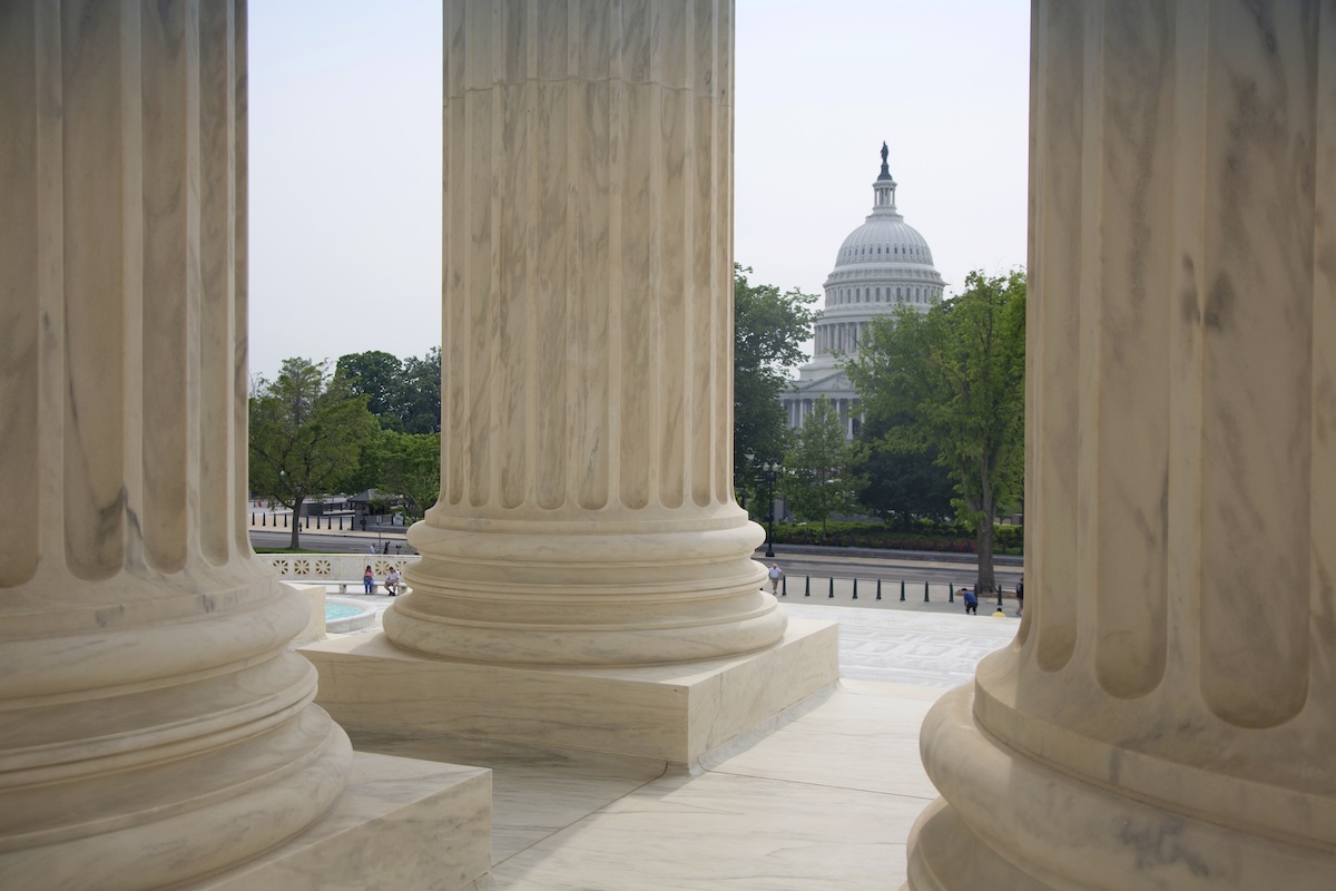 Capitol building seen from steps of Supreme court building.