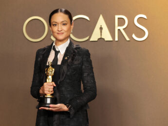 Woman poses with Oscar
