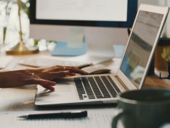 Person typing on laptop in office