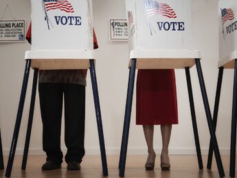 Voters voting in polling place