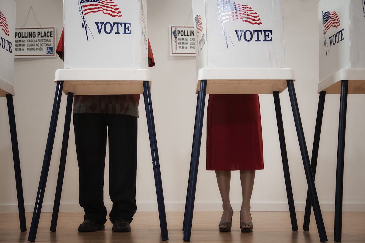 Voters voting in polling place