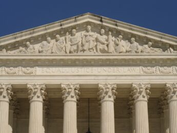 The motto of the U.S. Supreme Court, "Equal Justice Under Law," is inscribed over the front entrance of the courthouse.