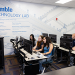 Trimble Technology Lab at LMU with two rows of students working on computers.