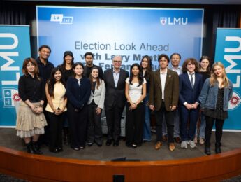 Students in Fernando Guerra's "California Politics" pictured on stage with host Larry Mantle.