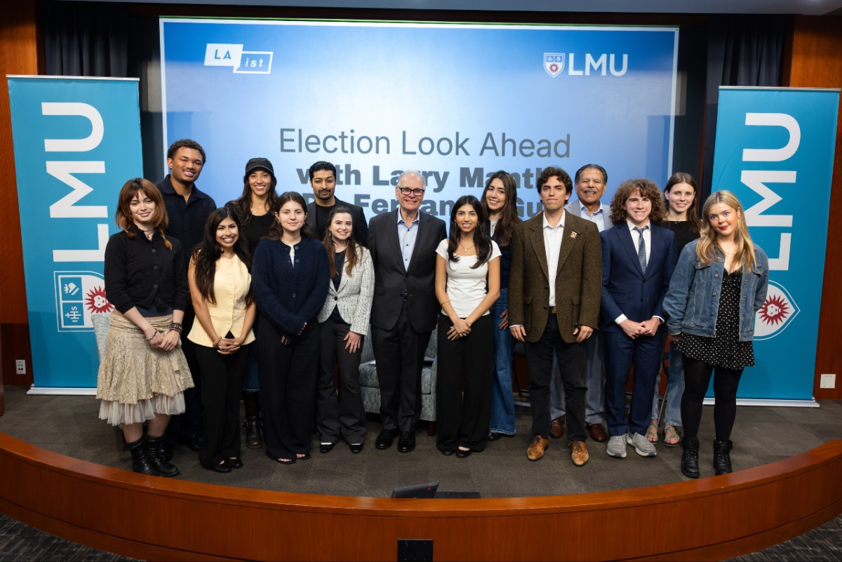Students in Fernando Guerra's "California Politics" pictured on stage with host Larry Mantle.