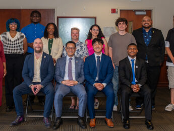 Students and administrators pose in business attire at the ASLMU and GSLMU Inauguration