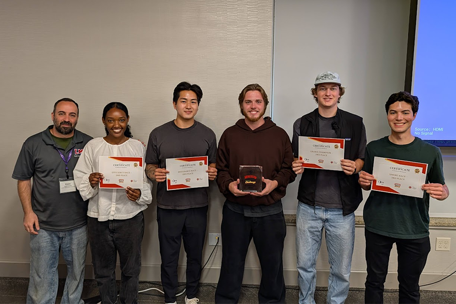 2026 Fluid Power Vehicle Challenge LMU team with second place certificates.