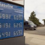 Gas station signage shows the high gasoline prices in CA