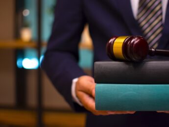 Lawyer carrying books and gavel
