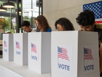 Group of people voting at a polling location