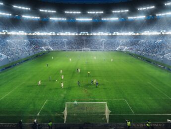 High Angle Shot Behind Goalkeeper Gates: Stadium with Soccer Championship Match. Teams Play, Crowds of Fans Cheer.