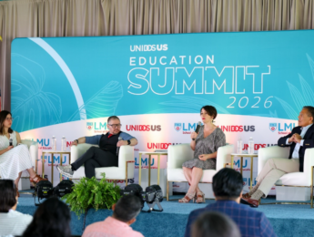 four people sitting on a state with a backdrop behind them of UnidosUS Education Summit