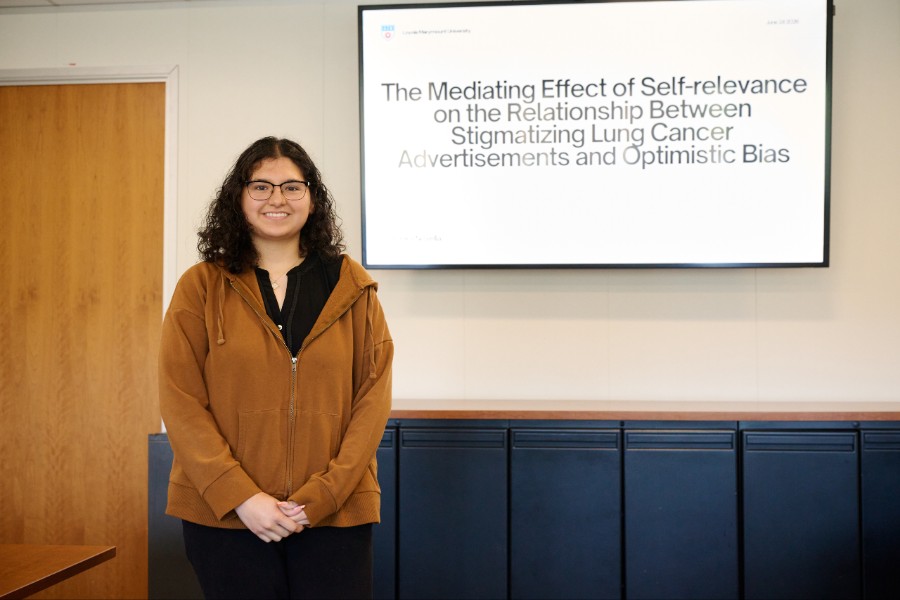 Areika Novella in classroom presenting summer research