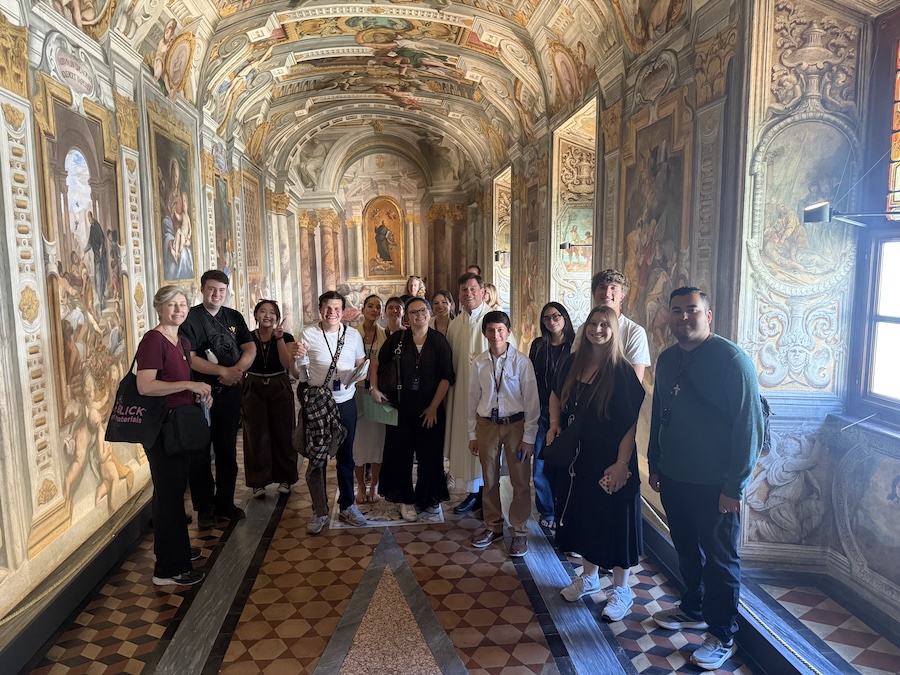 Students and faculty in the Rooms of St. Ignatius