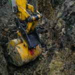 Digging a trench to replace a broken water pipe.