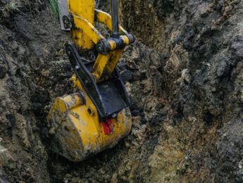 Digging a trench to replace a broken water pipe.