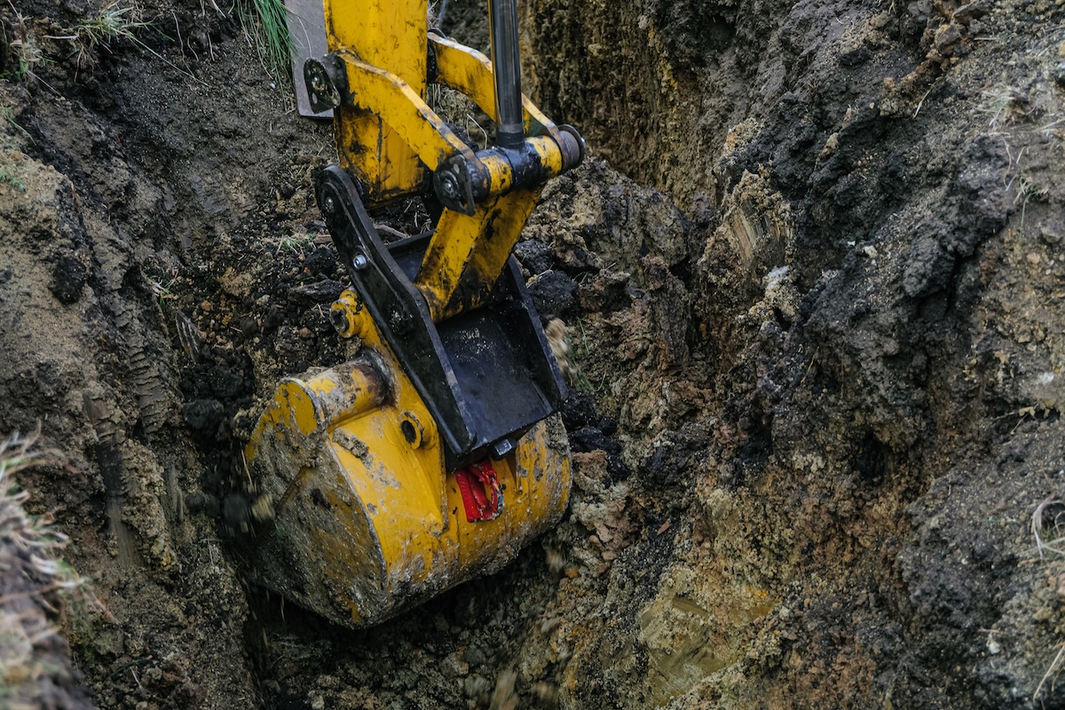 Digging a trench to replace a broken water pipe.