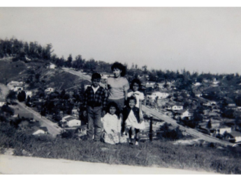 Esther Molano (back center) stands with family members Annie Huitron (back right) and Della Huitron (front right) atop a hill in the Palo Verde neighborhood. The other two children are unidentified. Courtesy Patsy Hinojosa, Chavez Ravine: An Unfinished Story archival collection