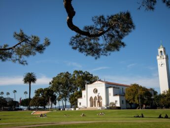 LMU campus with Sacred Heart Chapel framed by tree branches