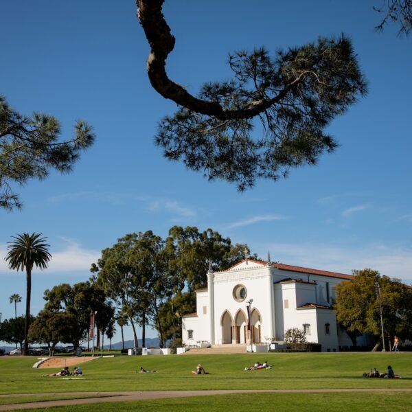 LMU campus with Sacred Heart Chapel framed by tree branches
