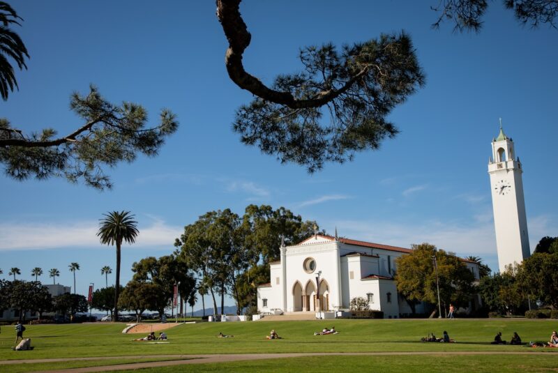 LMU campus with Sacred Heart Chapel framed by tree branches