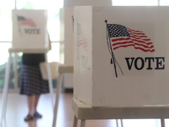 Voting booths stand ready for use in a U.S. election.