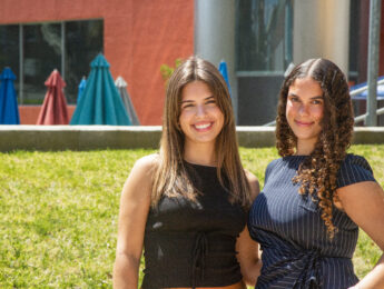 Isabella and Jimena, summer interns, pose in front of Loyola Law School